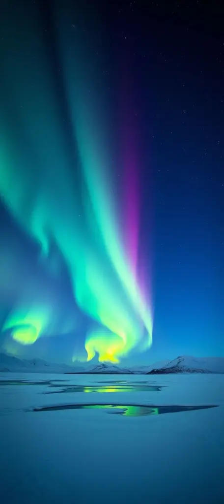 Northern Lights over a snowy landscape.