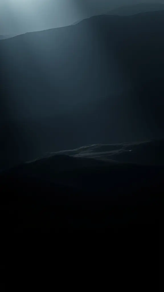 Moody landscape with dramatic shadows and soft light.