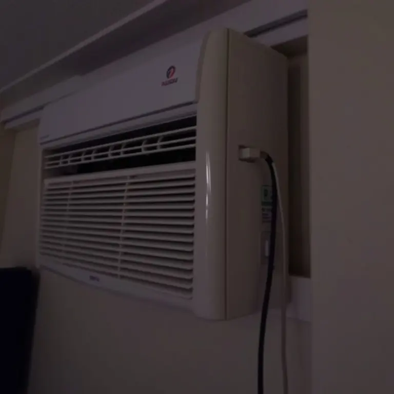 An air conditioner with its lights dimming.