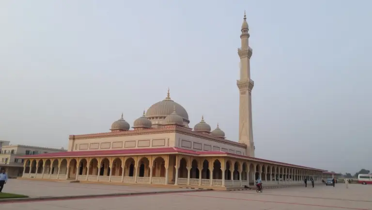 A large mosque with white domes and minarets.