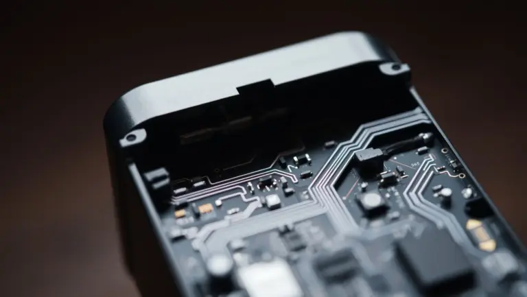 Close-up of electronic adapter internals showing circuit board.
