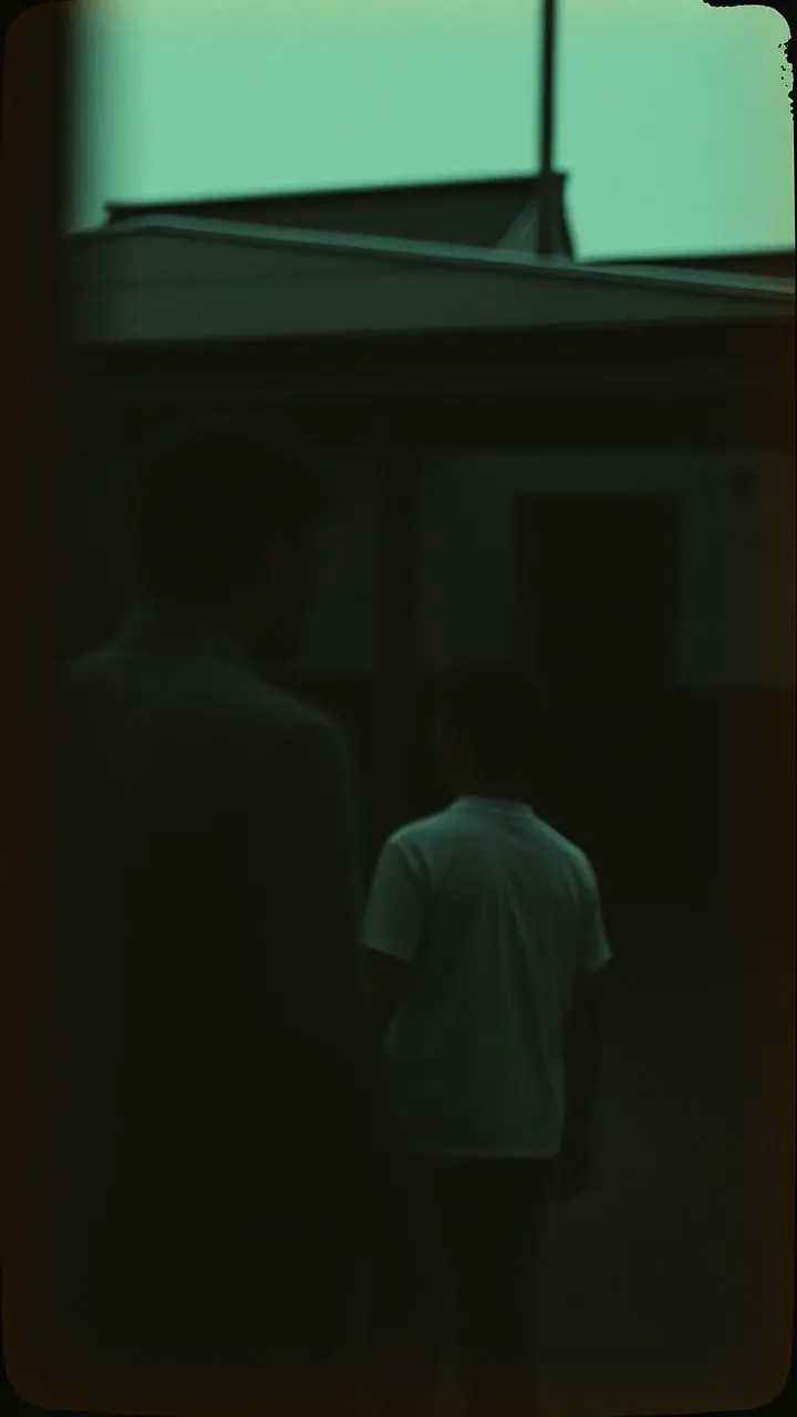 Cinematic portrait with film grain, muted colors, and atmospheric lighting.