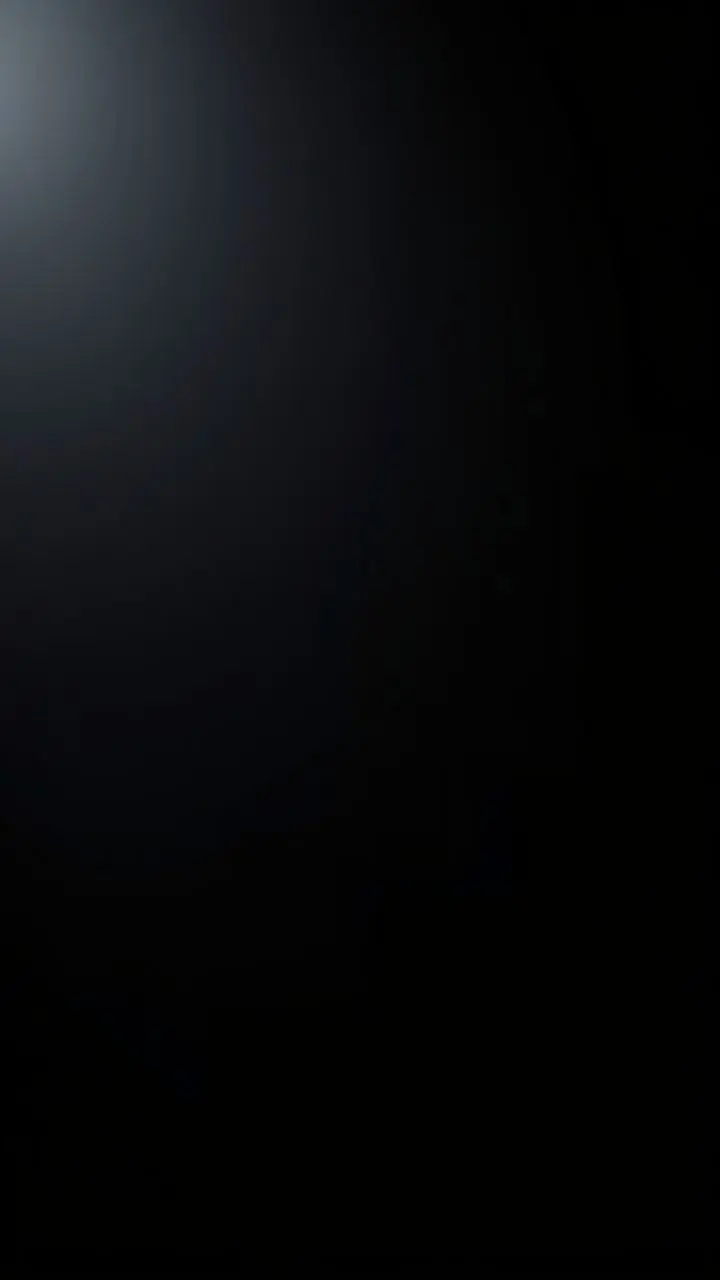 Minimalist design in deep true black with matte finish and subtle lighting.