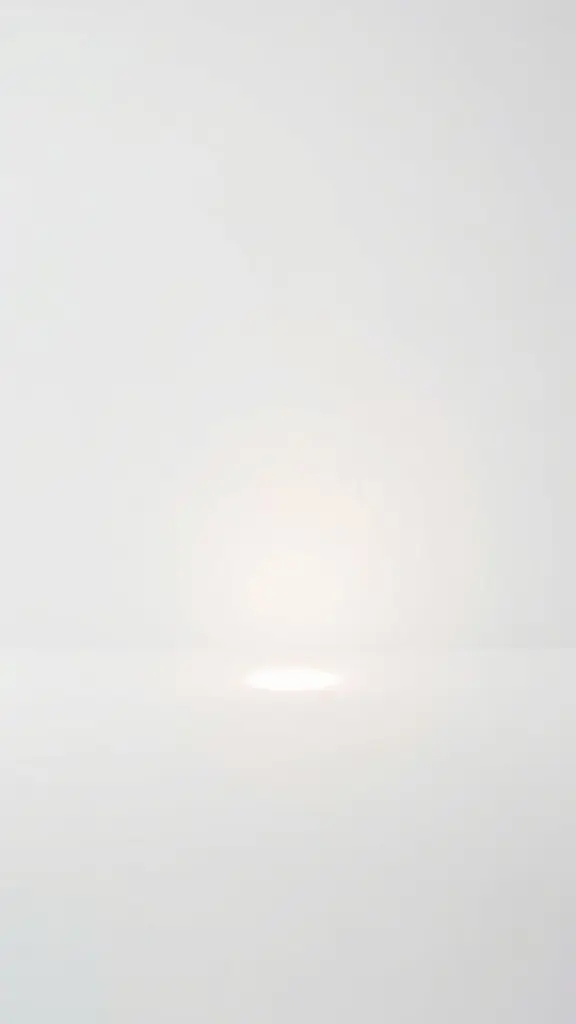 Minimalist composition with soft light on a white background.